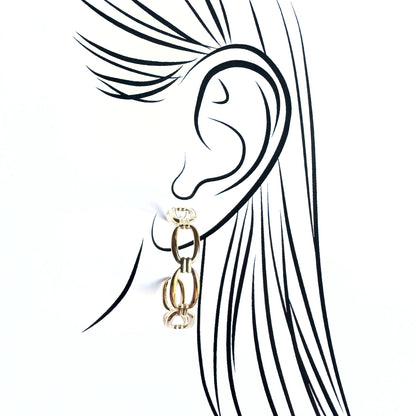 Gold IRL chain hoop earrings with linked rings worn on illustrated ear