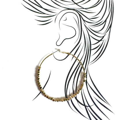 Gold hoops with delicate faceted elements drawn in elegant outline style