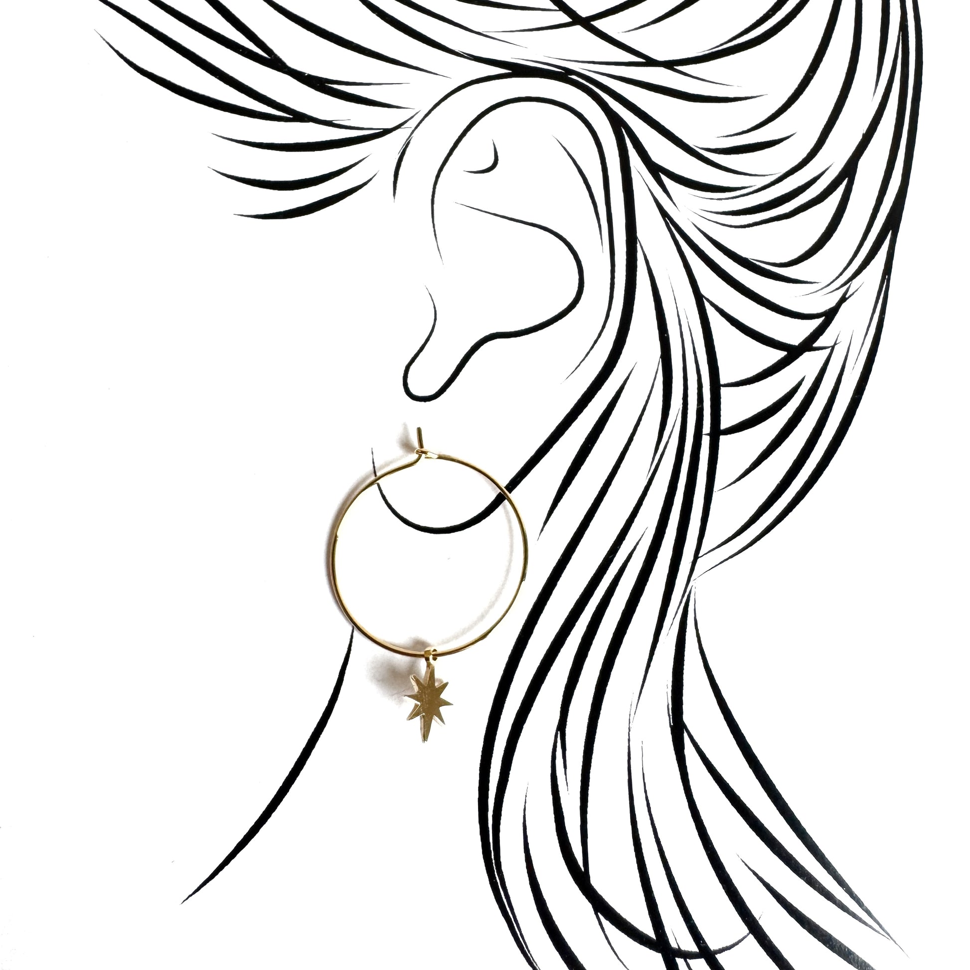 Gold hoop earrings with delicate star charm and polished surface shine