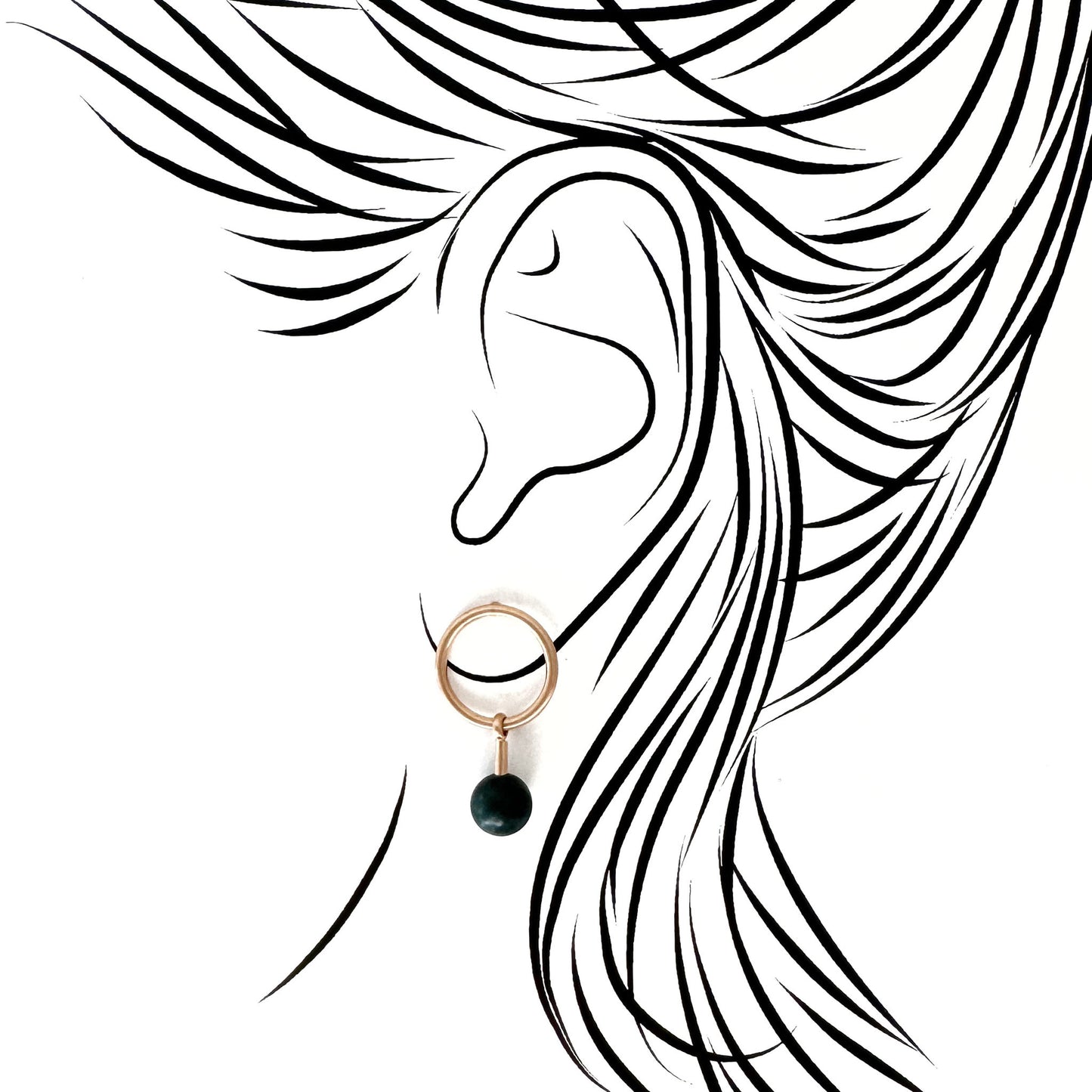 Pilgrim gold hoops with deep green stone drop; mirror polish contrasted by the stone’s matte depth