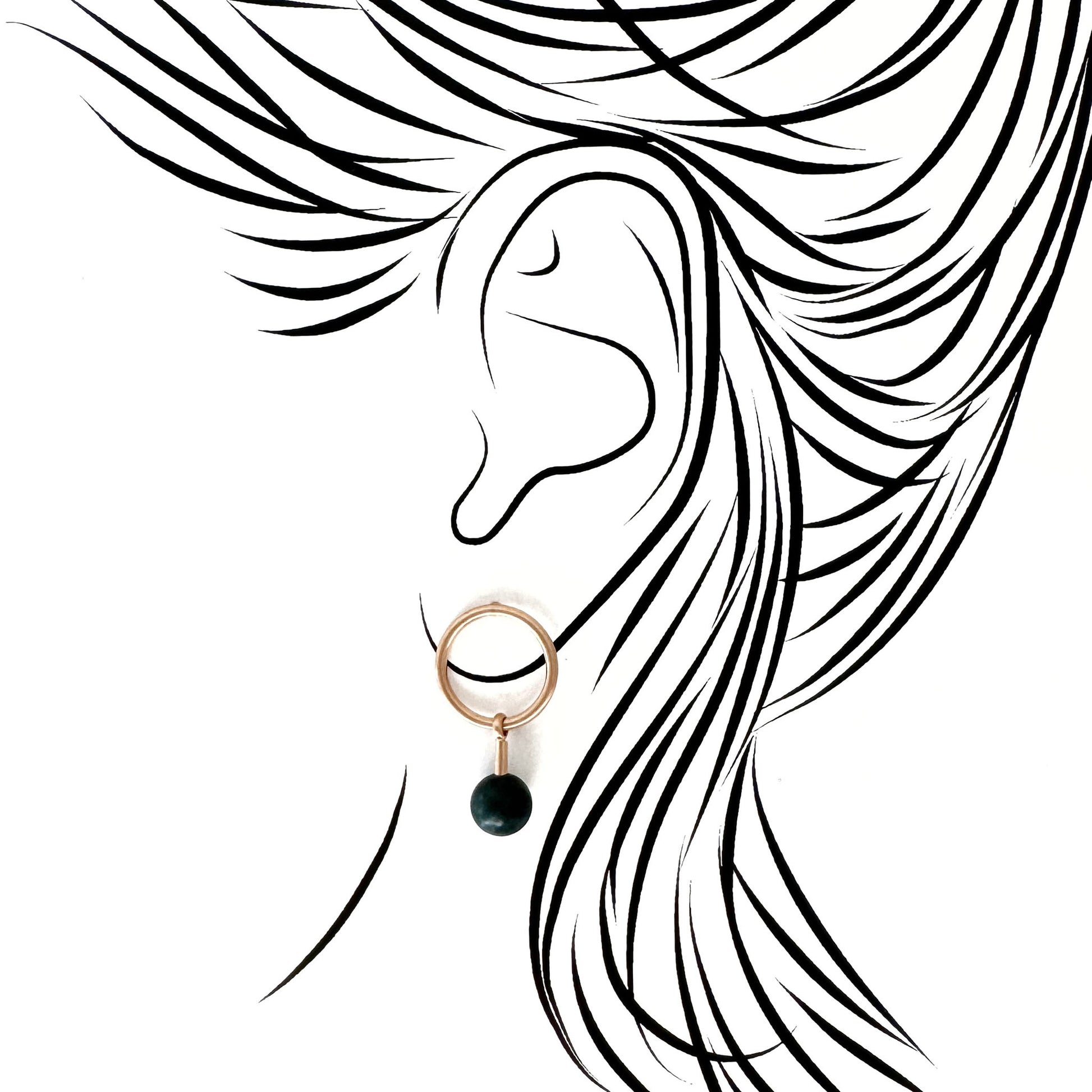 Pilgrim gold hoops with deep green stone drop; mirror polish contrasted by the stone’s matte depth