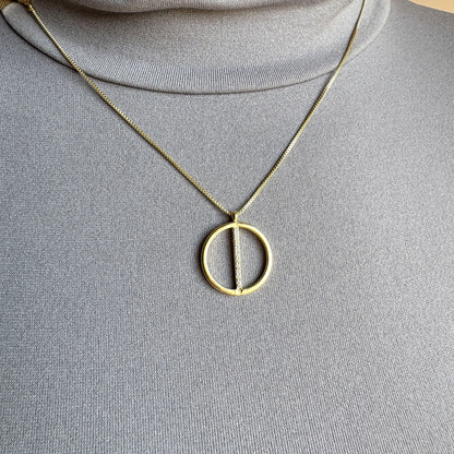 Gold Pilgrim necklace with geometric circle pendant and zircons worn on neck