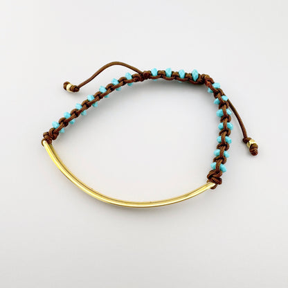 Vergoldetes Love Bridge Armband von Thomas Sabo mit Türkissteinen und verstellbarer brauner Kordel