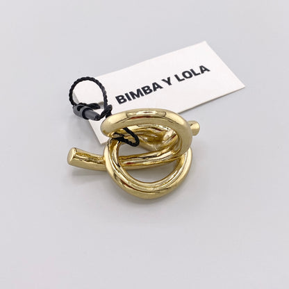 Bague nœud sculpturale Bimba y Lola à finition dorée vue du dessus avec son étiquette