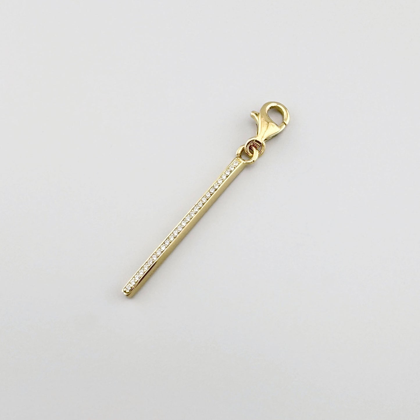 Gold-plated zirconia bar charm Thomas Sabo with a slim polished form