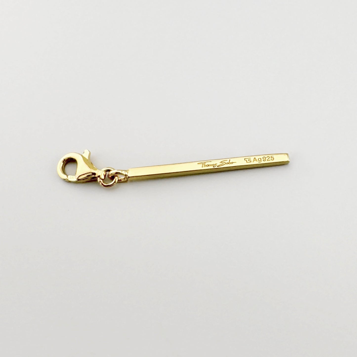 Charm barre doré Thomas Sabo avec zircones et fermoir mousqueton