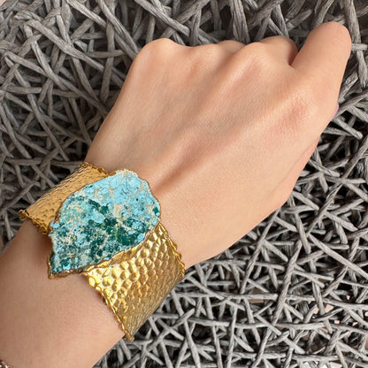 Gold-plated cuff bracelet with raw turquoise stone and textured finish