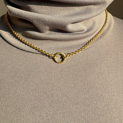 Elegant Pilgrim necklace with a delicate circle pendant in gold finish
