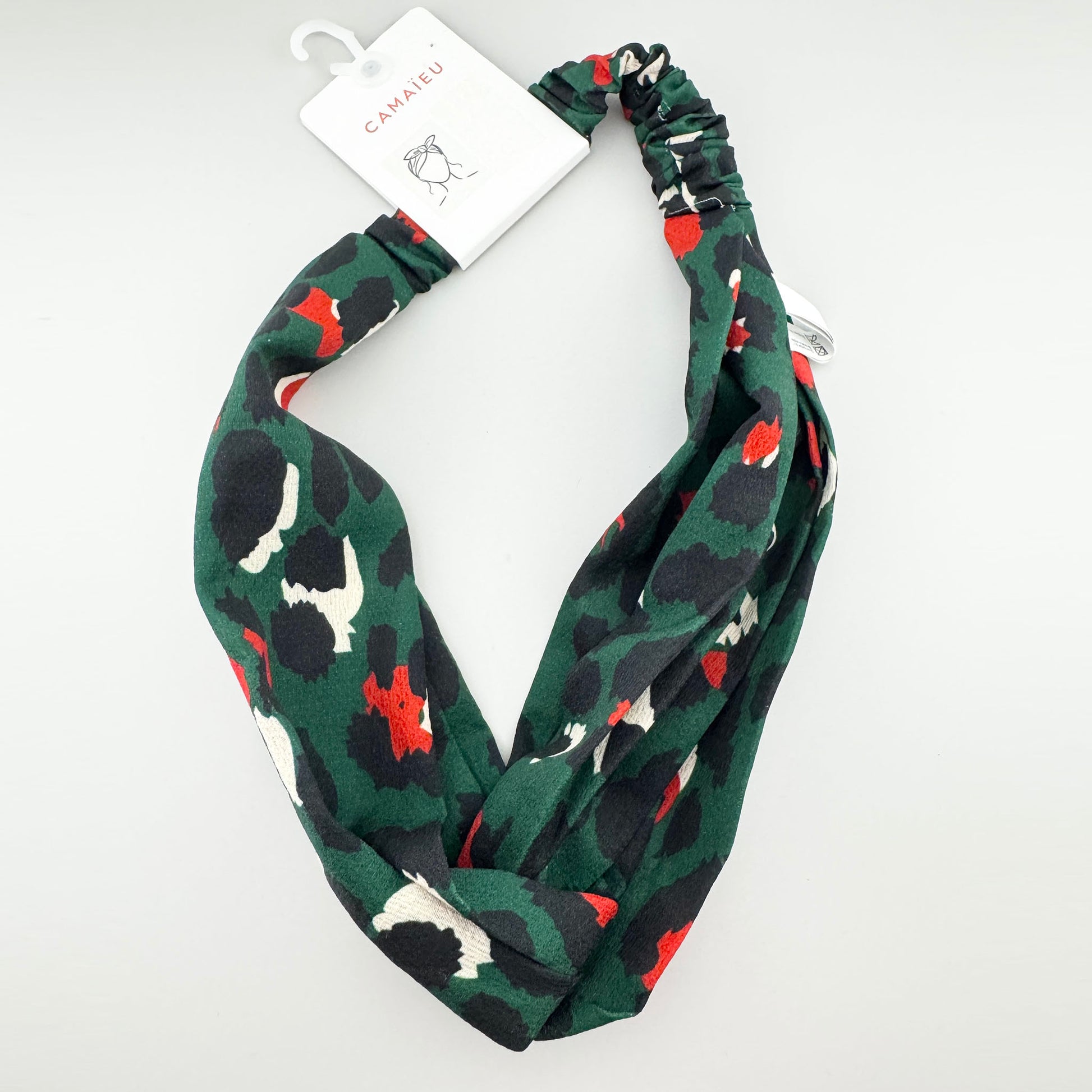 Green patterned headband Camaïeu with a soft gathered band and colorful abstract print