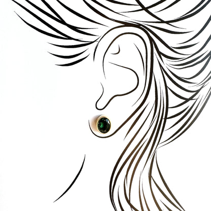 Illustration of earrings with green quartz highlighting elegant proportions
