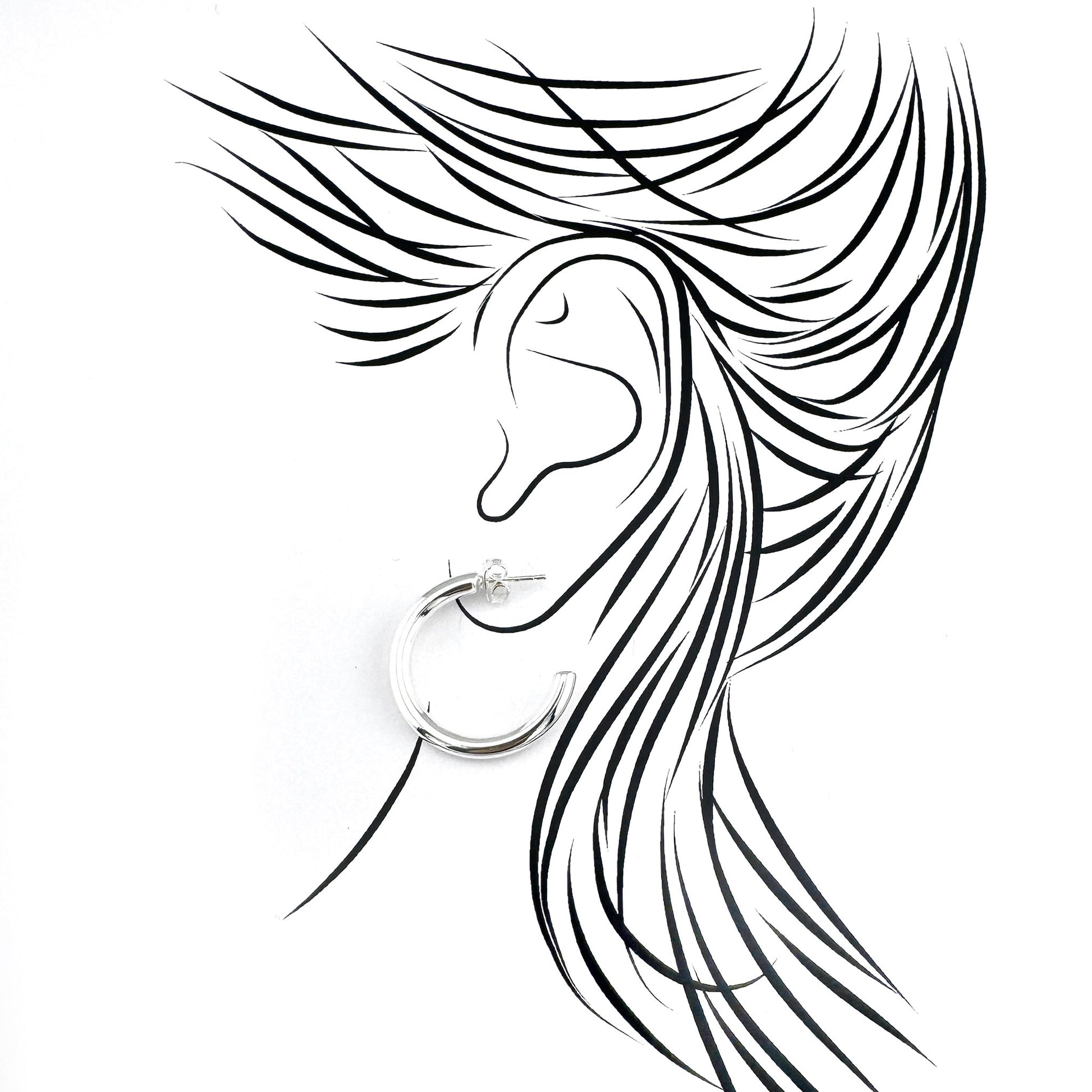 Polished half-hoop earrings in plated stainless steel, clean curves catching light with a modern minimalist mood