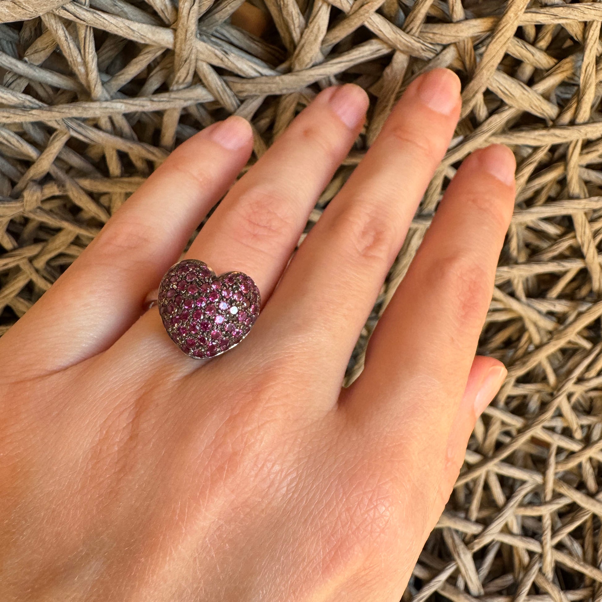 Silver heart ring by Bliss Gioielli with pink cubic zirconia worn on hand