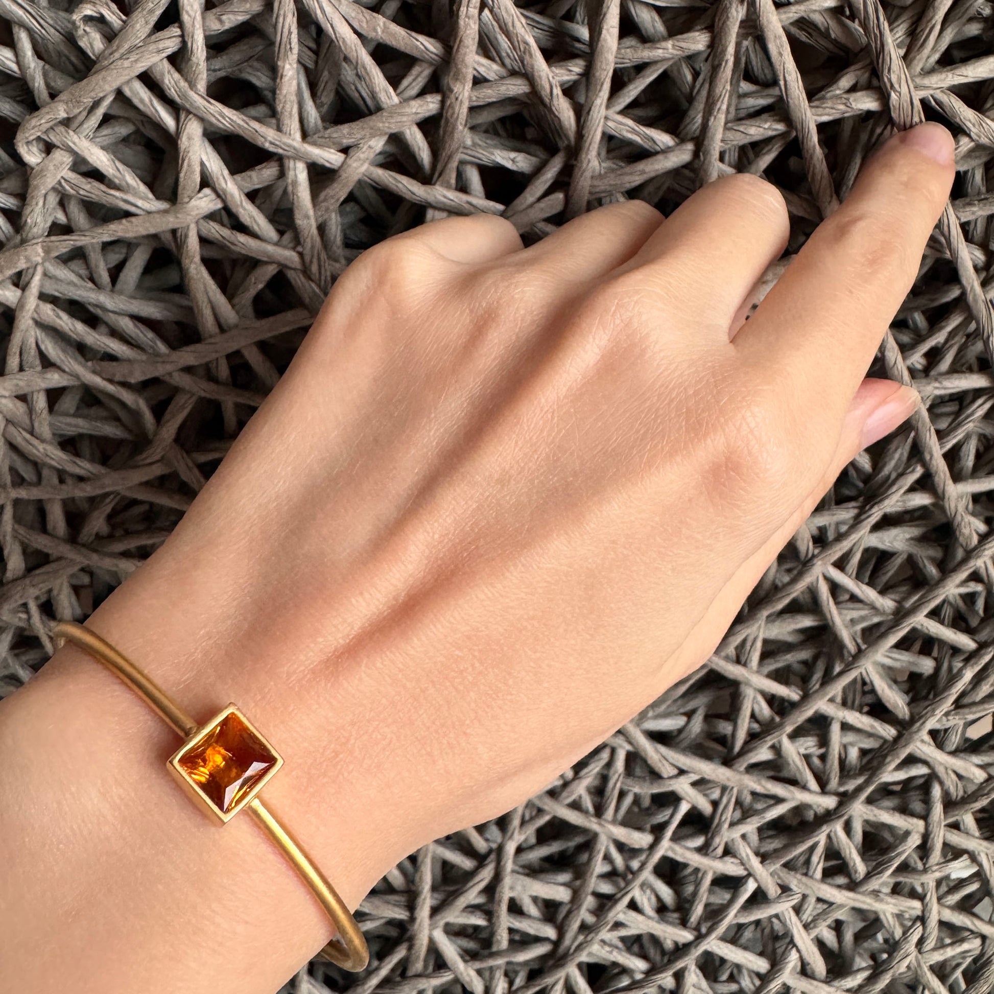 Honey crystal bracelet worn on the wrist with a warm golden glow