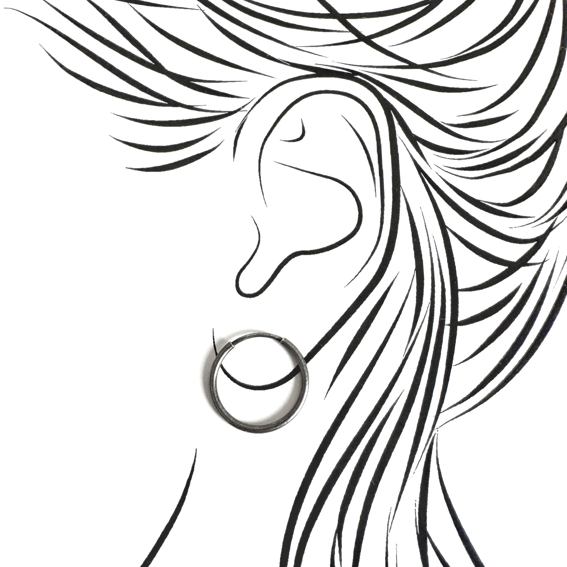 Silver hoop earrings LULU Copenhagen worn on the ear with a clean minimalist line