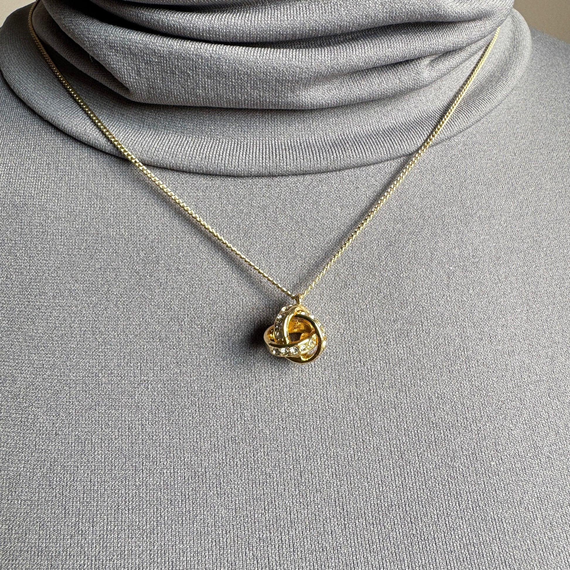 Elegant Pilgrim necklace with knot-shaped pendant and sparkling zirconia stones