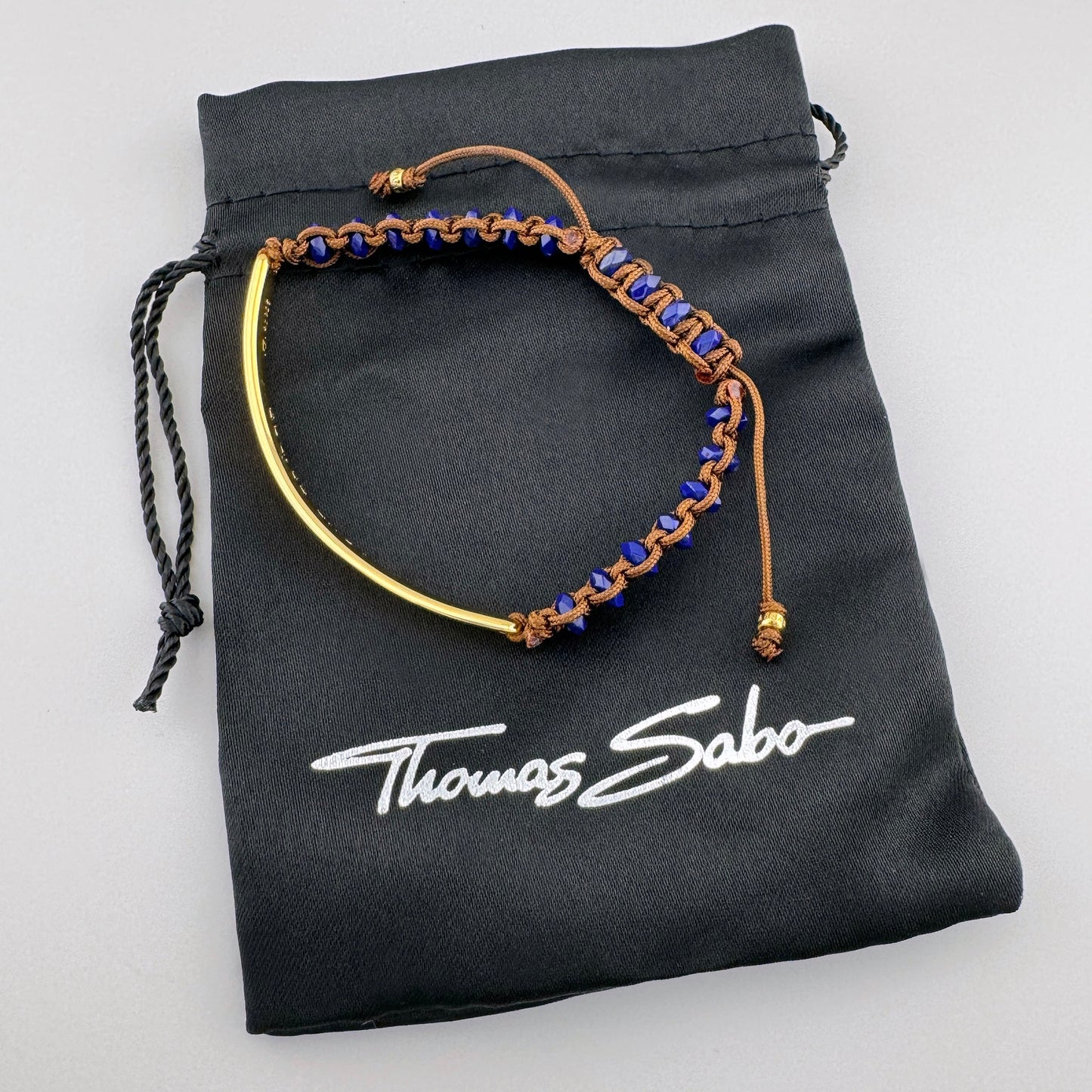 Lapis lazuli bracelet Thomas Sabo with braided cord and gold-tone center bar