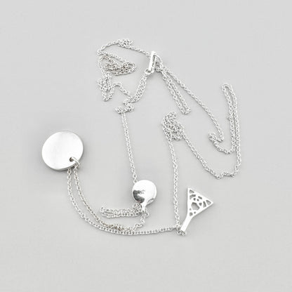 Pilgrim necklace with three pendants arranged on a light background with branded tag