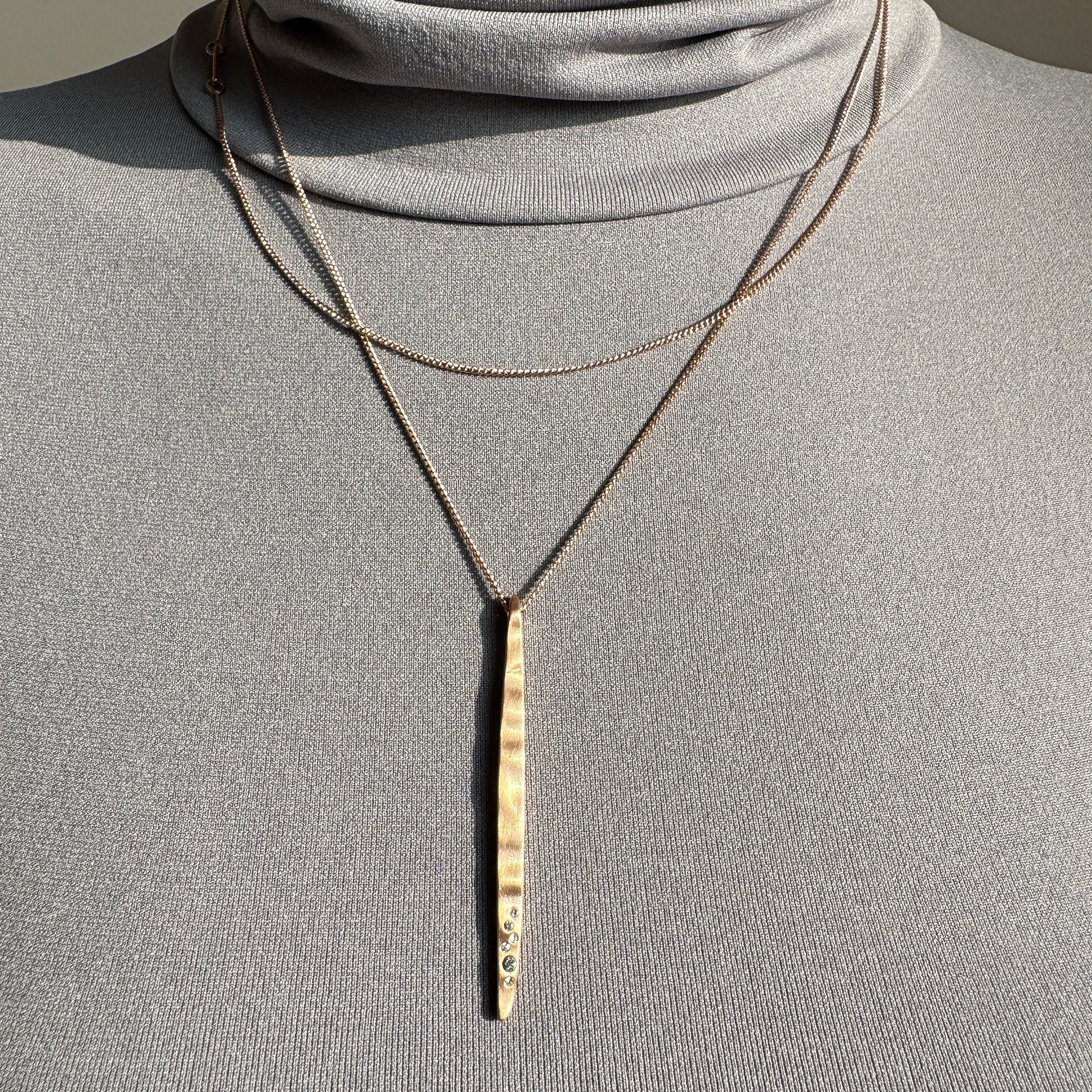 Elegant Pilgrim necklace with long matte pendant and delicate zircon line detail