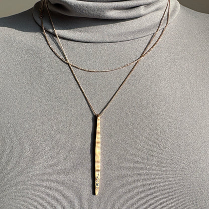 Elegant Pilgrim necklace with long matte pendant and delicate zircon line detail
