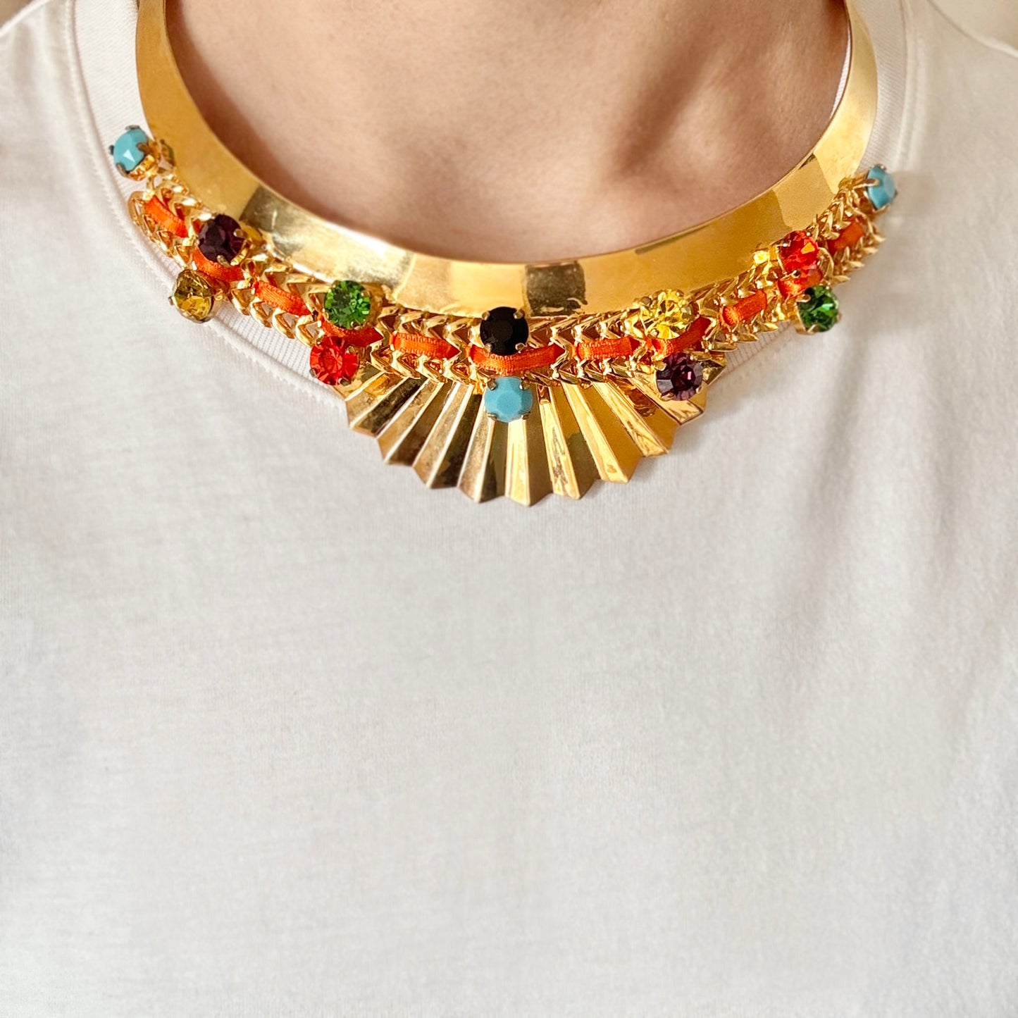 Gold choker necklace adorned with multicolor crystals and luxury detailing