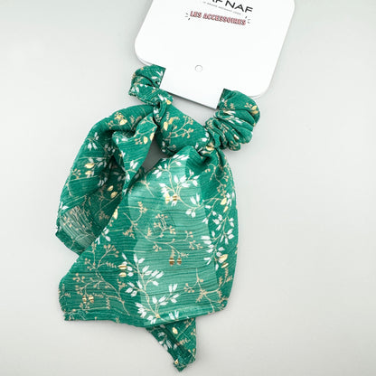 Green Naf Naf bow scrunchie with a light gold floral print and soft shape