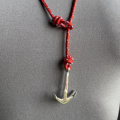 Shiny anchor pendant on red rope necklace with navy pattern