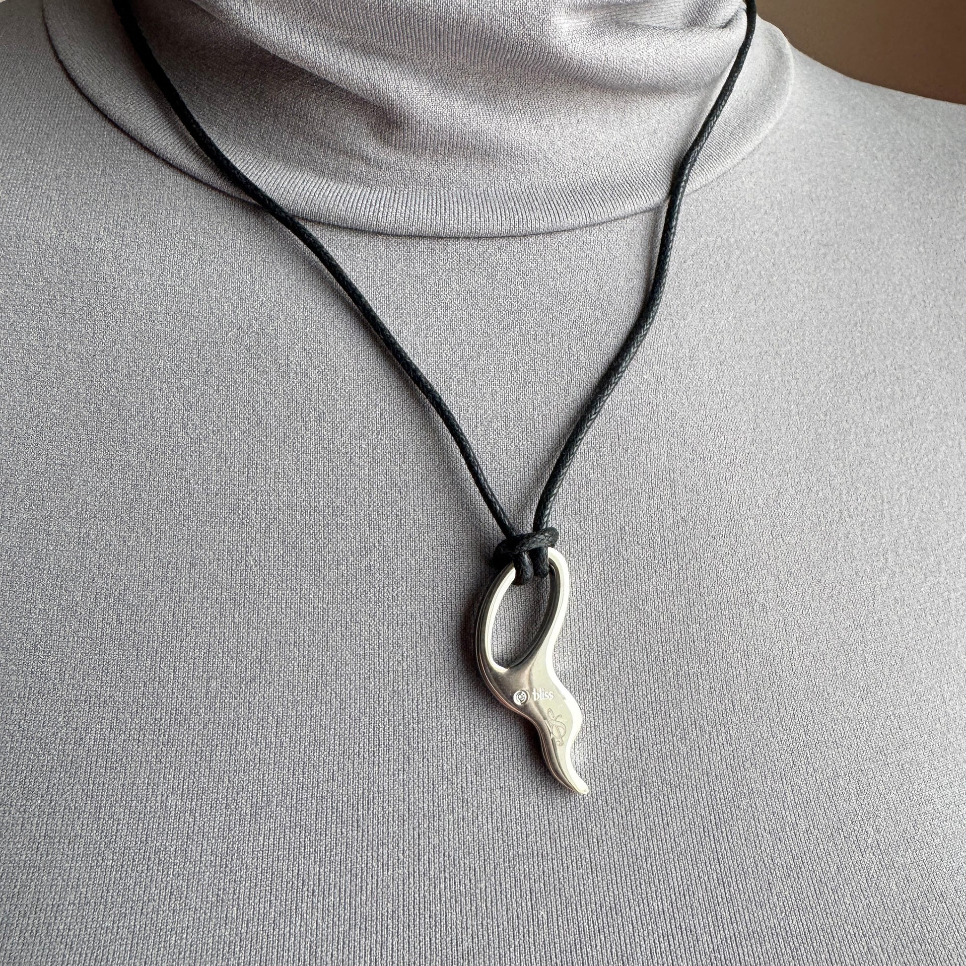 Cord necklace Bliss Gioielli worn on the neck with a sculptural polished pendant