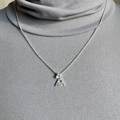 Pilgrim silver necklace with delicate triangle pendant and crystal worn on neck