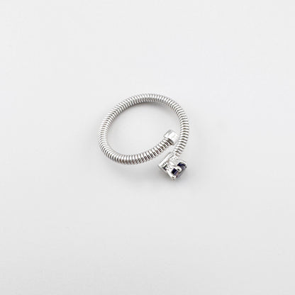 Bague argentée en spirale avec pierre naturelle bleu foncé