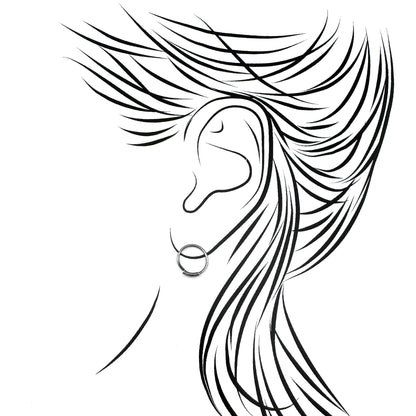 Oxidized 925 silver hoop earrings, smooth curves catching light, refined minimalist mood