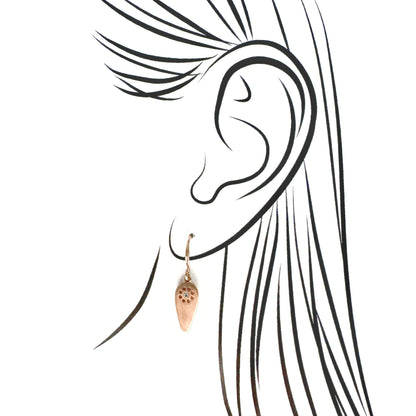 Pilgrim rose-gold tone crystal earrings on ear illustration, satin matte drops with sun-perforated detail