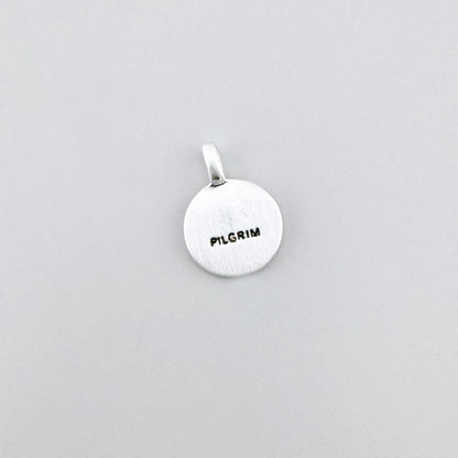 Pilgrim crystal pendant in silver tone showing the engraved back side