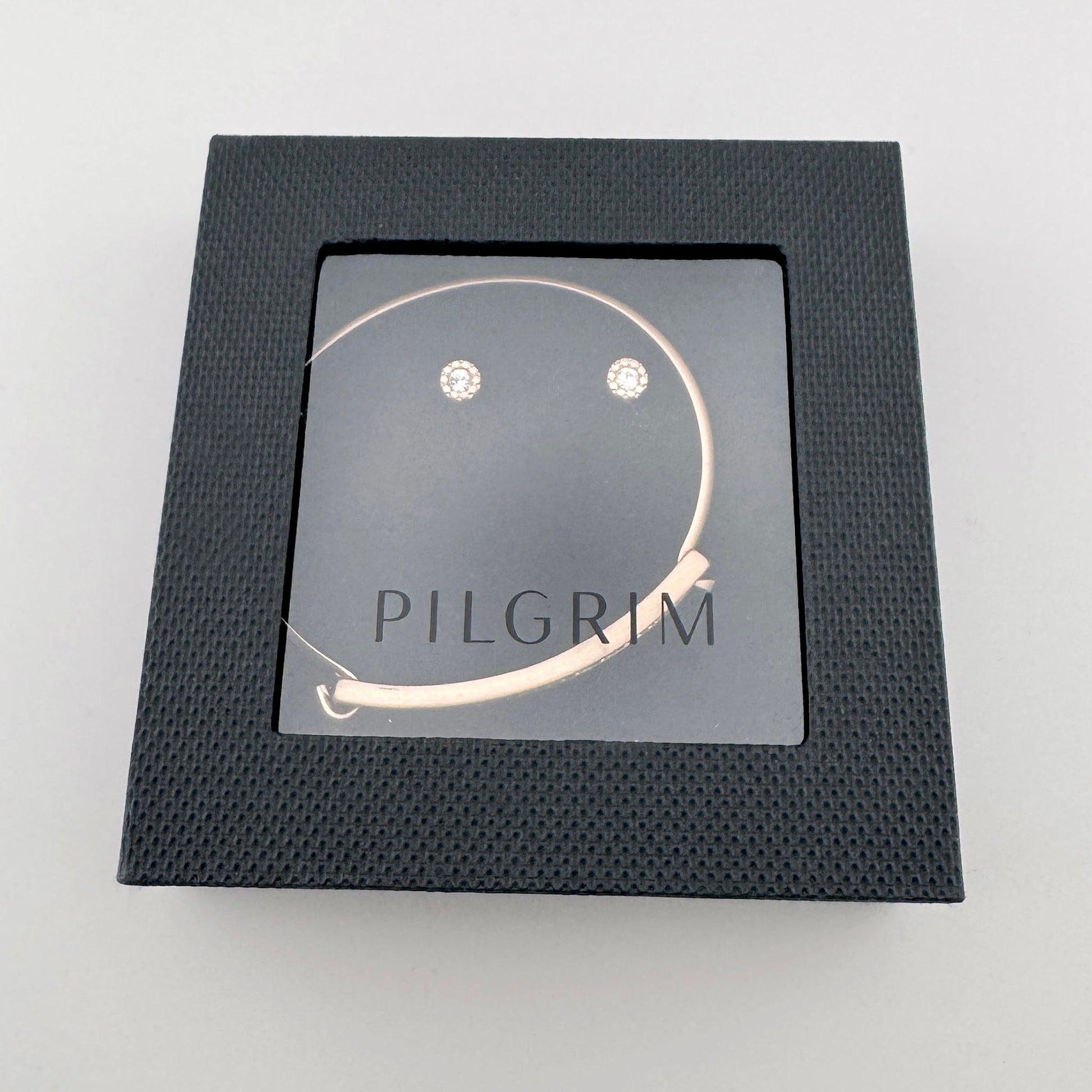 Pilgrim jewelry set earrings on a branded card with a delicate crystal shine