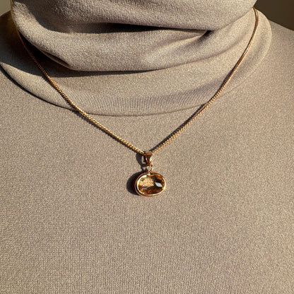 Pilgrim necklace with faceted peach crystal worn on mannequin