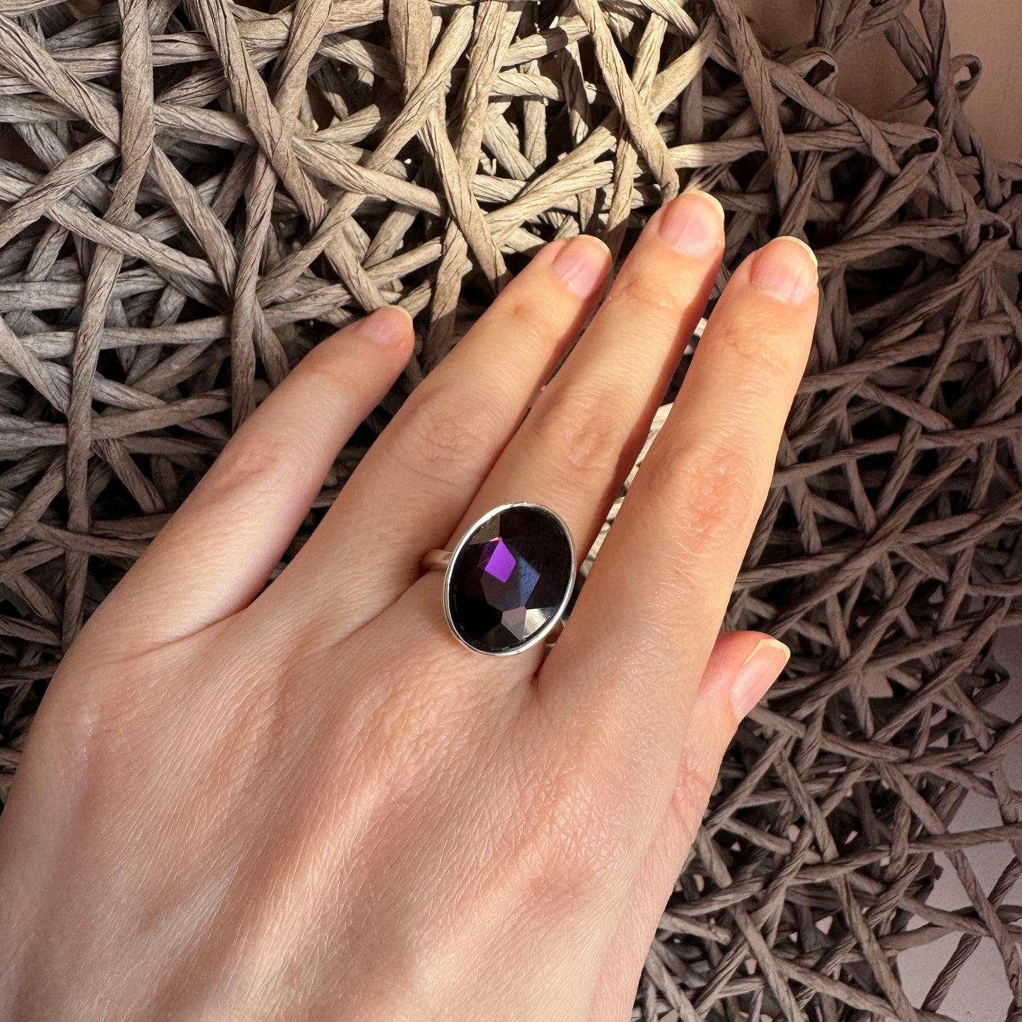 Pilgrim adjustable ring with a faceted deep purple stone and polished metal