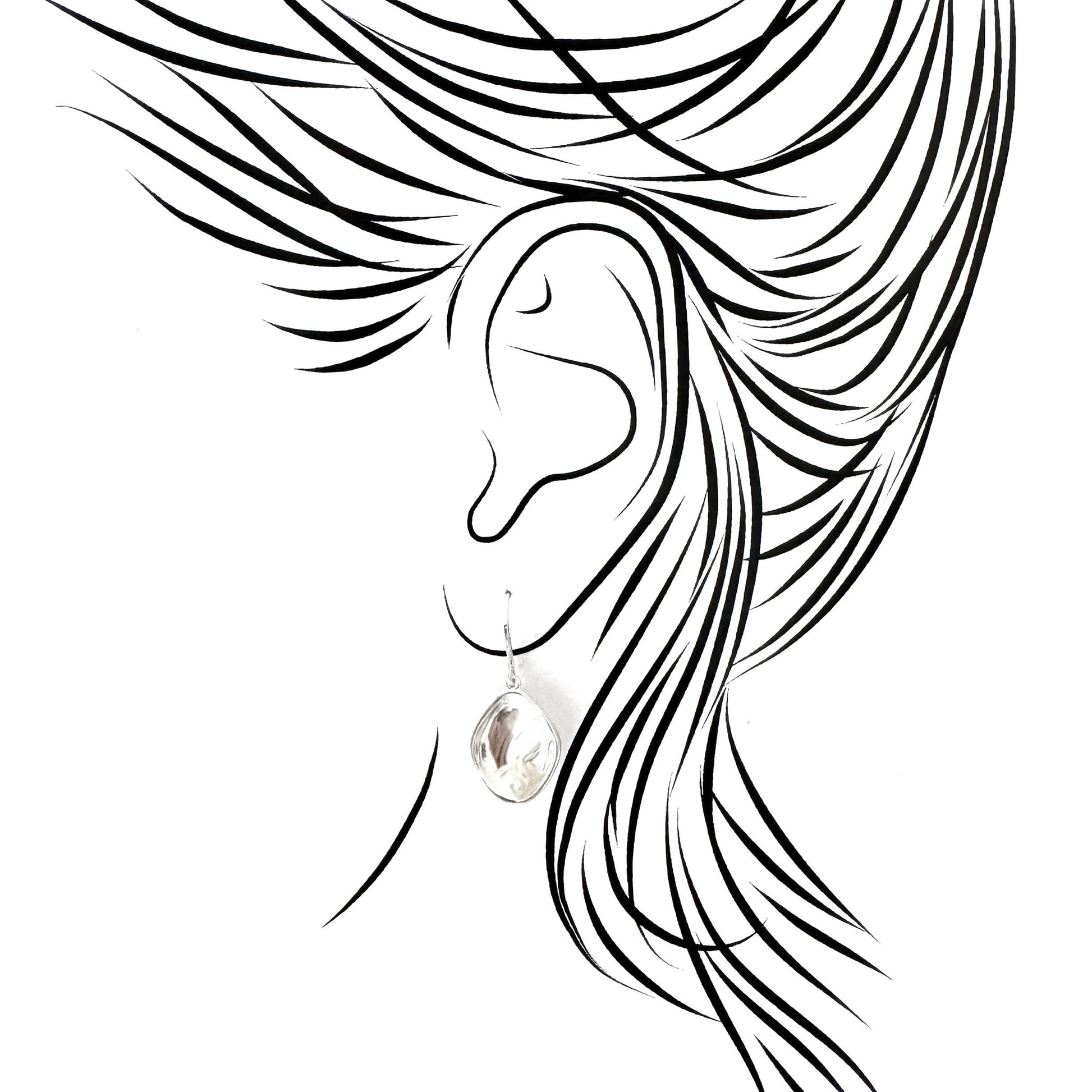 Silver drop earrings with asymmetric design on ear illustration