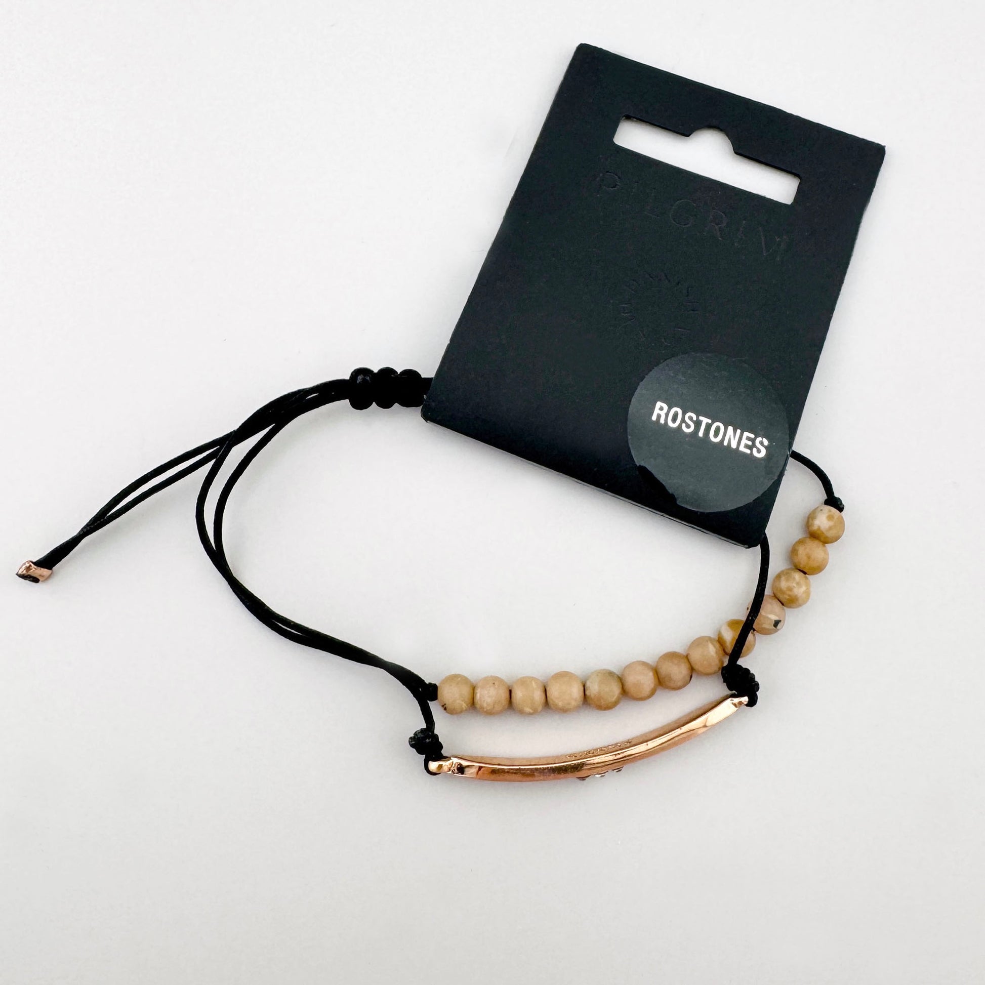 Armband mit Natursteinen auf schwarzem Band mit feinem roségoldfarbenem Akzent