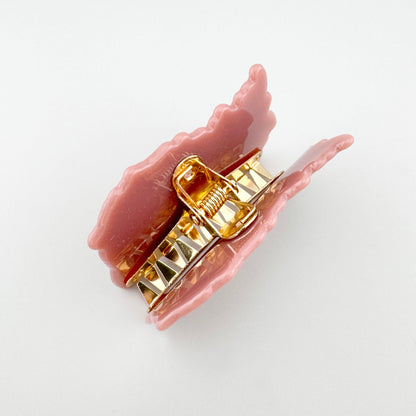 Haarspange mit Ananasmotiv auf rosa Hintergrund und goldfarbenem Mechanismus