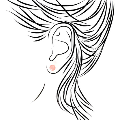 Pilgrim pink ball studs with a soft translucent glow and cool silver setting, clean and minimal