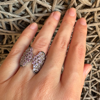 Elegant silver ring with purple stones by Bliss Gioielli worn on hand
