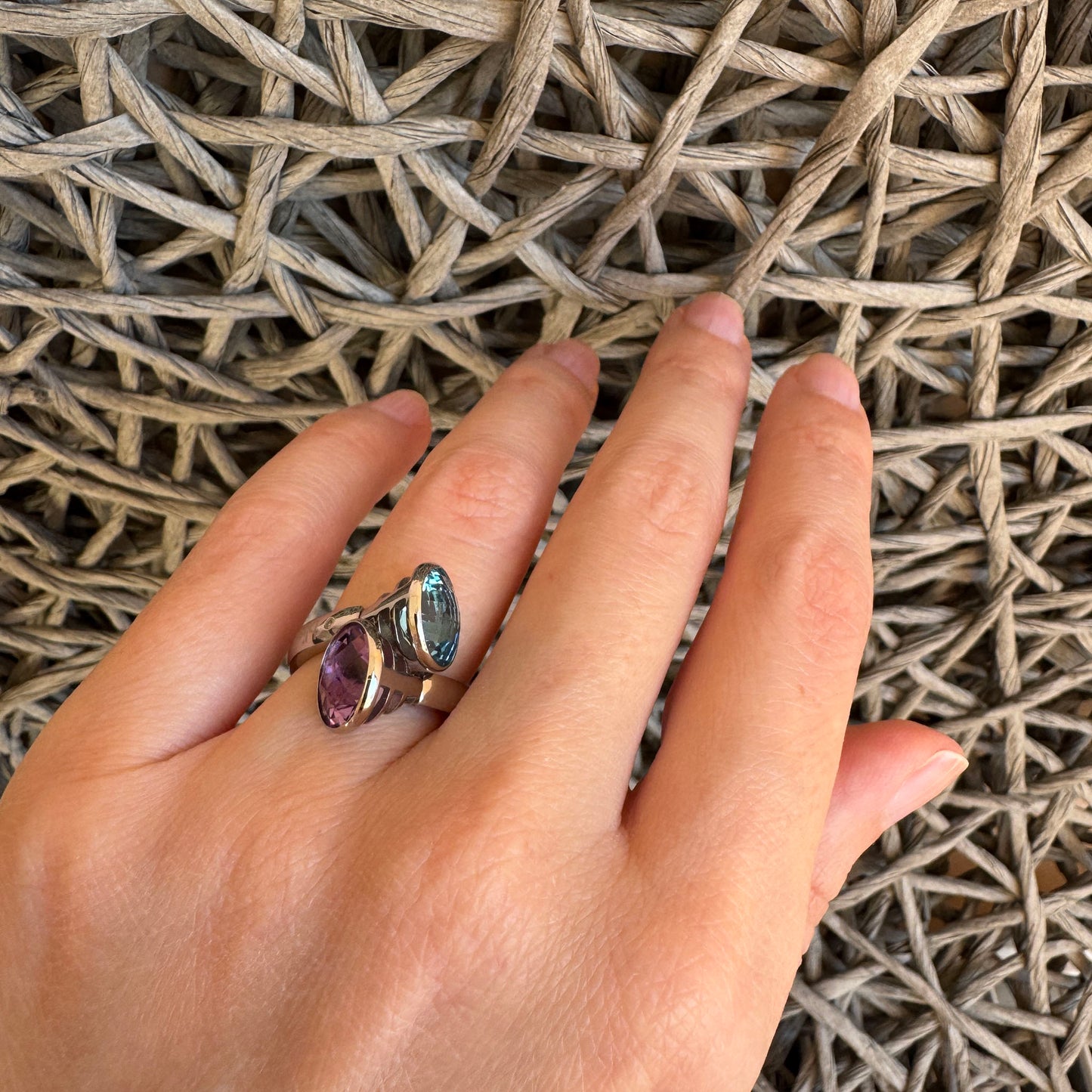 Quartz duo ring worn on hand showing contrast of violet and blue stones