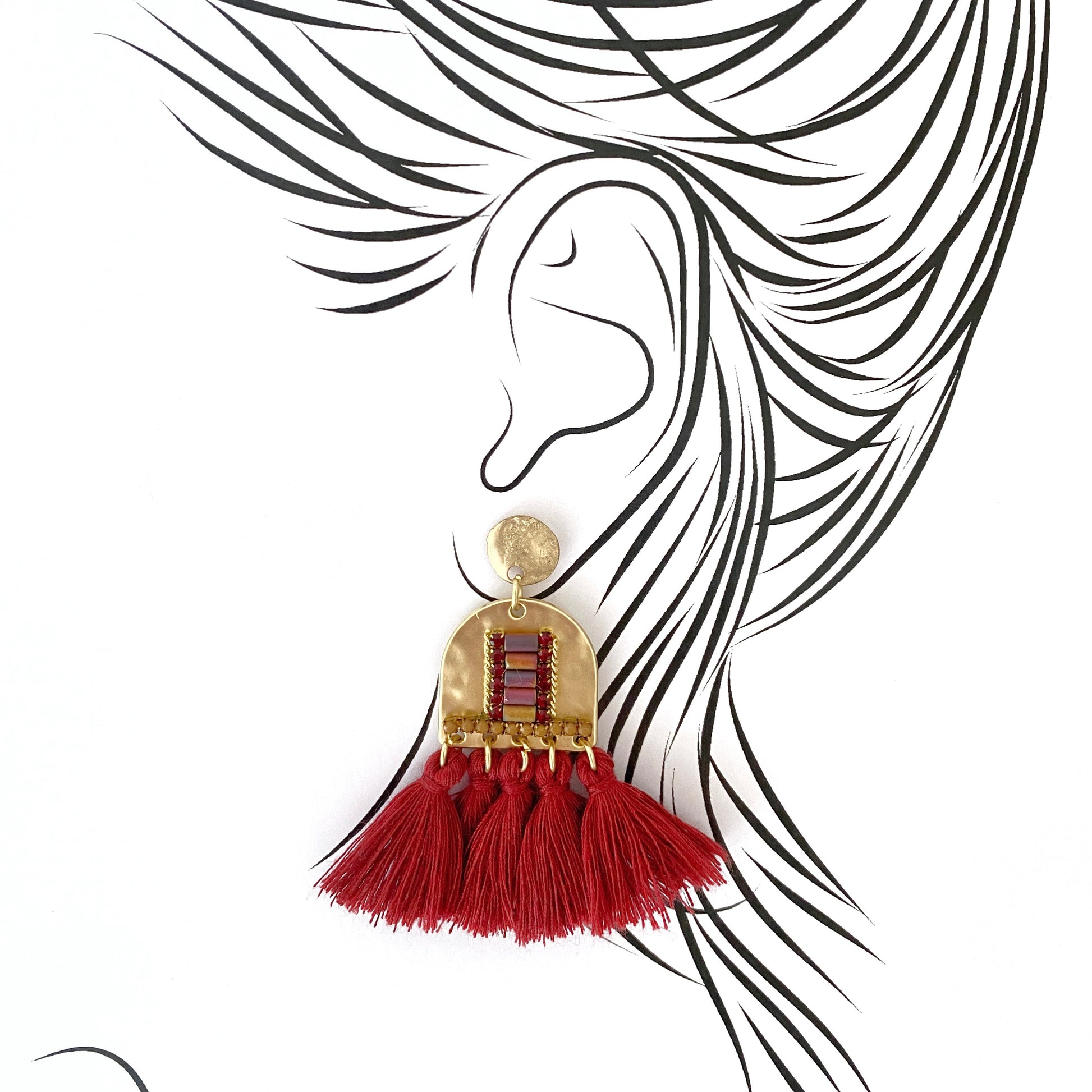 Ethnic-style earrings with red tassels and gold-tone studs