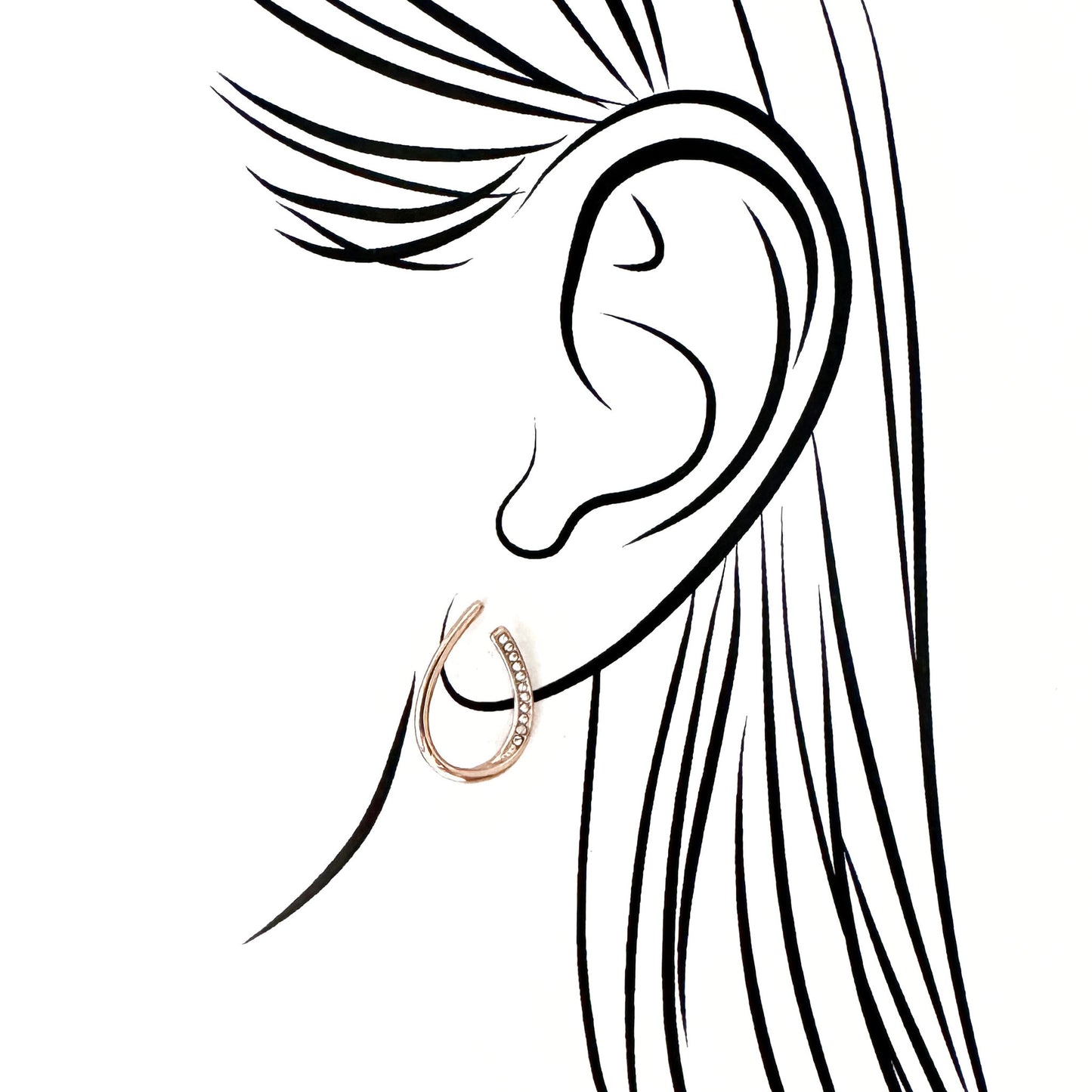 Elegant rose gold teardrop earrings with zirconia accents and asymmetrical form