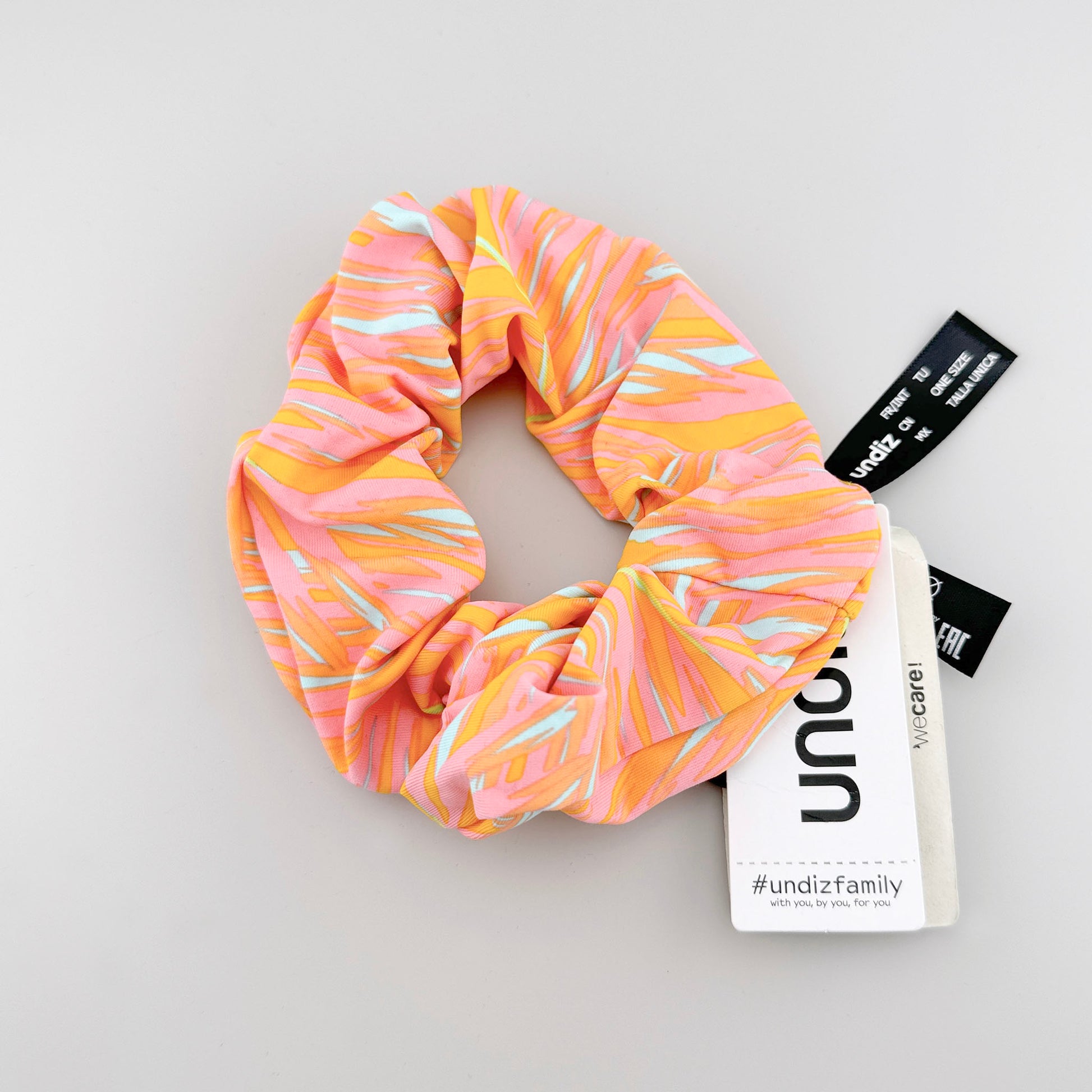 Tropical Undiz scrunchie with pink and yellow tones and a soft gathered shape