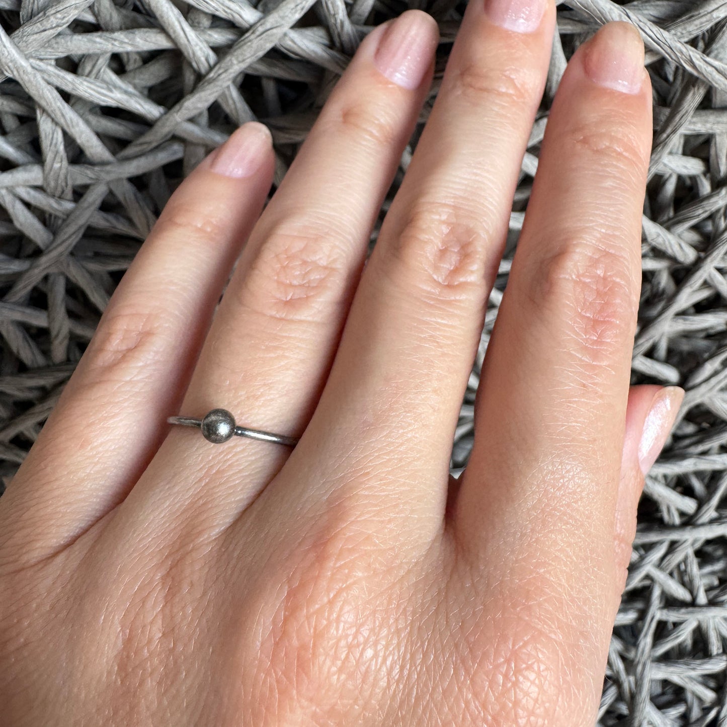 Oxidized 925 silver ball ring by LULU Copenhagen on white, clean sculptural circle with calm minimalist mood