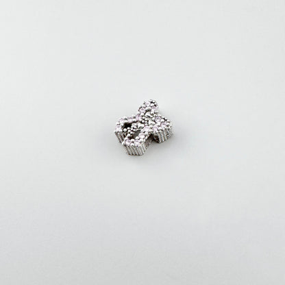 Silver bow charm Bliss Gioielli with an openwork shape and textured sparkle