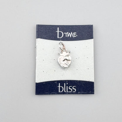 Silver heart charm Bliss Gioielli shown on its branded display card