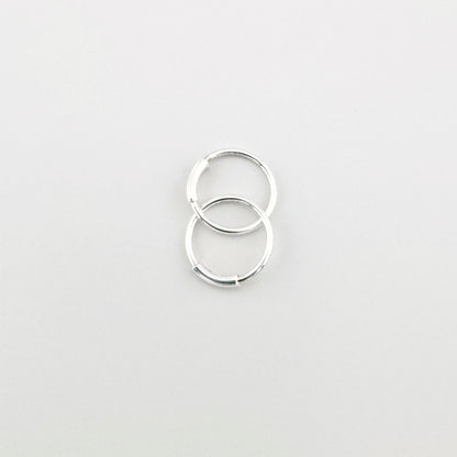 Créoles en argent 925 LULU Copenhagen, cercles polis au reflet discret, style minimal