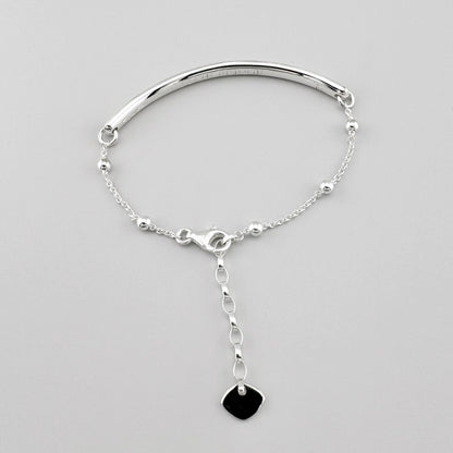 Bracelet Love Bridge en argent Thomas Sabo disposé en cercle avec chaîne réglable et pendentif cœur noir