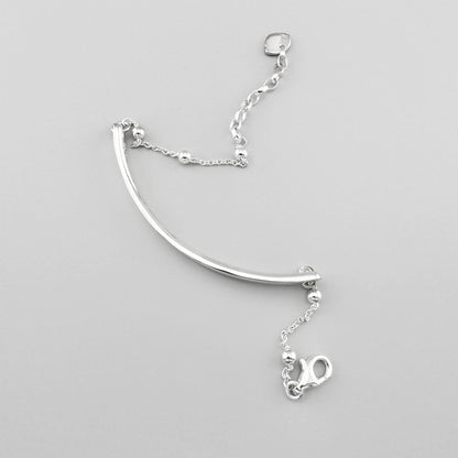 Silver Thomas Sabo Love Bridge bracelet with a polished curved bar and delicate beaded chain